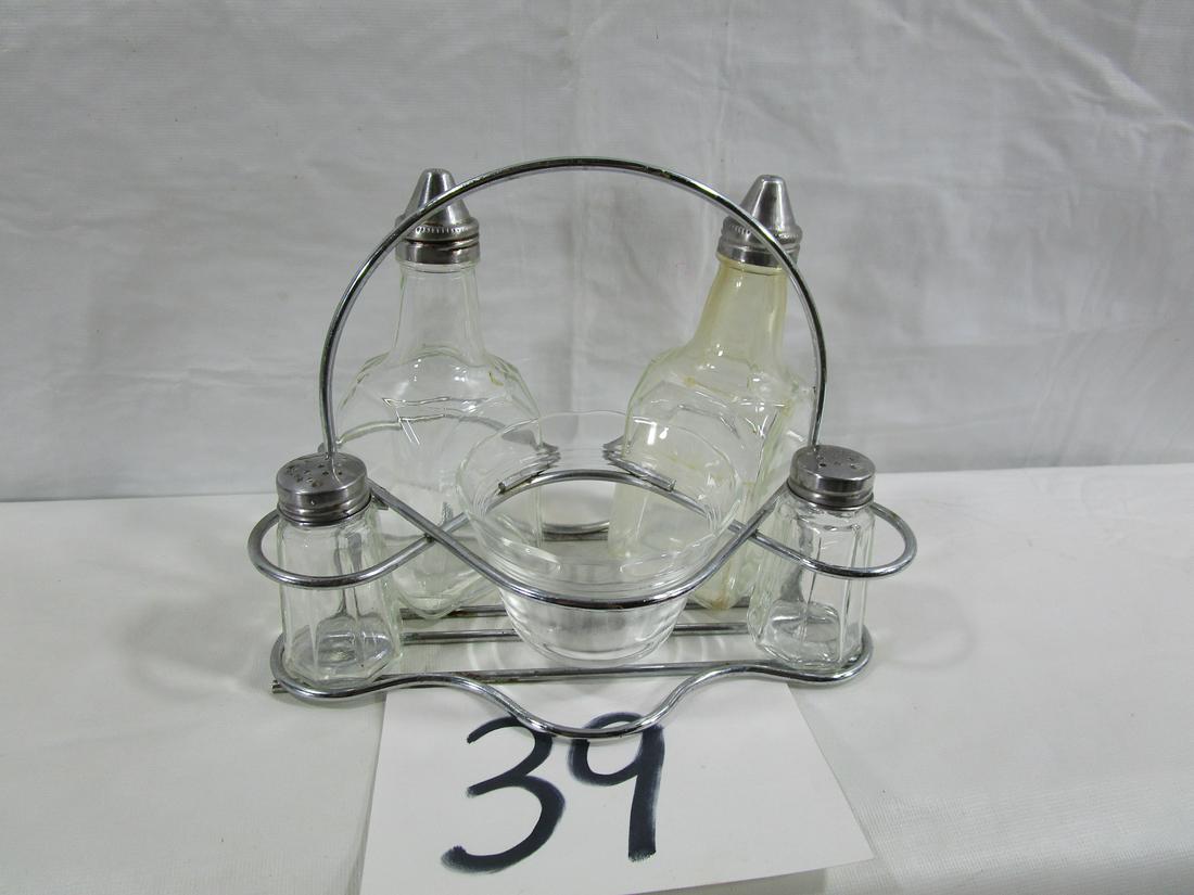 Vintage Glass Table Set: This set includes two cruets, salt and pepper shakers and a small custard style condiment dish. One cruet has some fogginess to it that looks a little yellow but would probably come out with a good cl