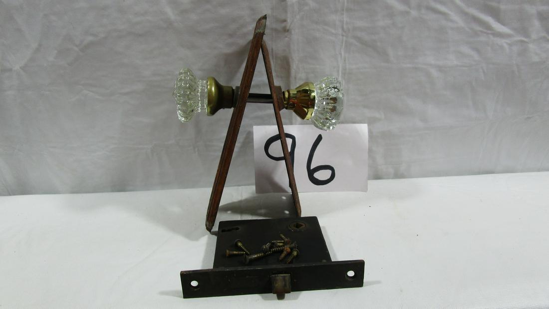 Beautiful Glass Door Knob Set: This set comes with the lock system and back plates. The door knobs appear to be a little different but both measure about 2" diameter. They are both in nice condition. The metal pieces do show wear a