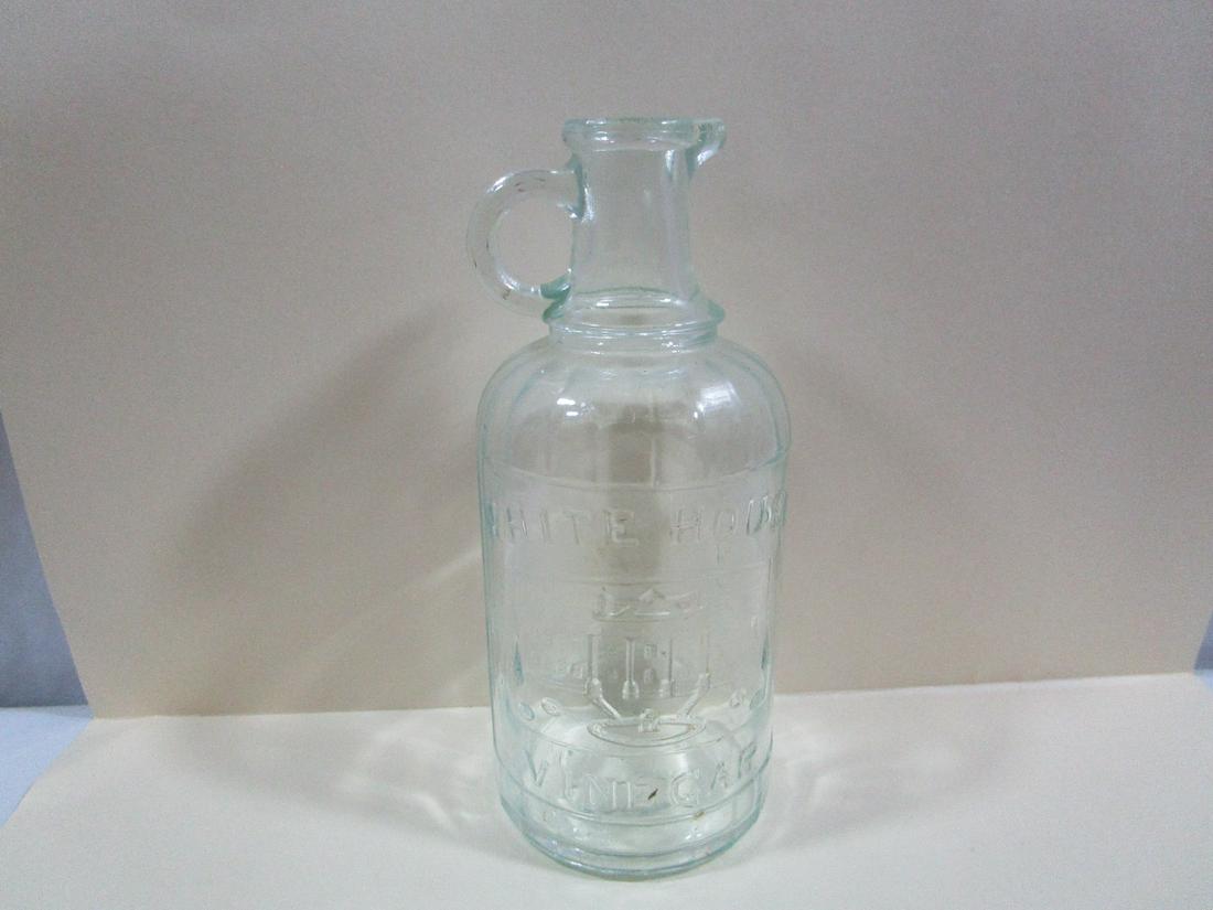 Vintage White House Vinegar Pint Bottle Light Aqua: This little jug is about 7.5" tall and 3" diameter. It has a chip on the handle but no other damage seen.