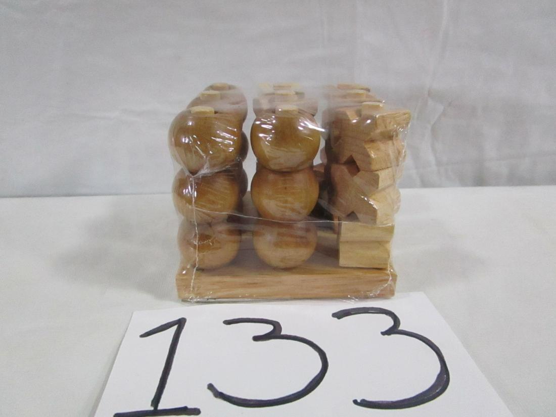 Wooden Tic Tac Toe Game Sealed: This game is sealed and comes with instructions. It is a dimensional version of Tic Tac Toe. Excellent, new condition.