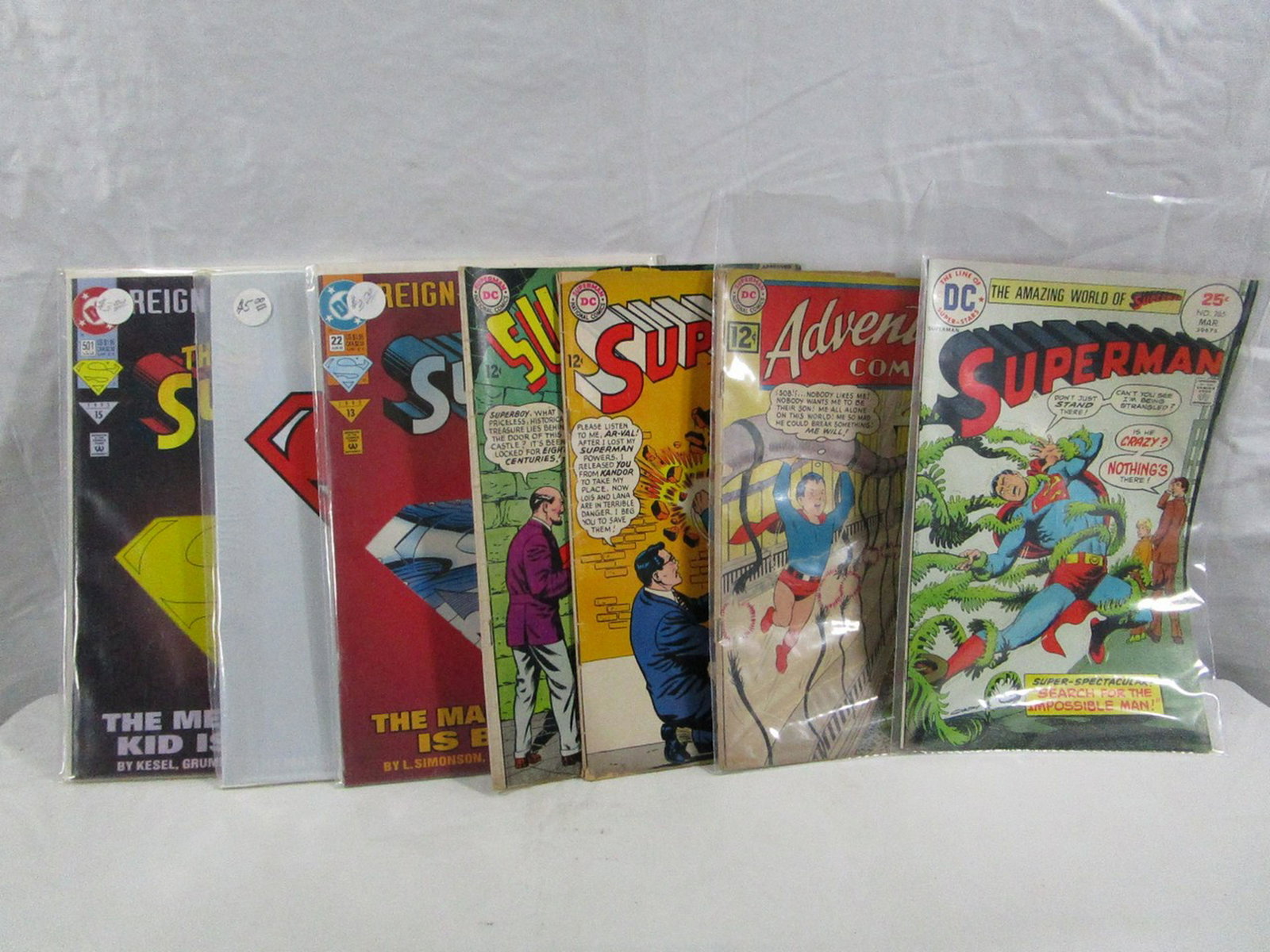 Lot Of 7 DC Comics Superman Superboy: This lot of comics are mainly in protective sleeves with the exception of 2 of them but they are in decent condition.
