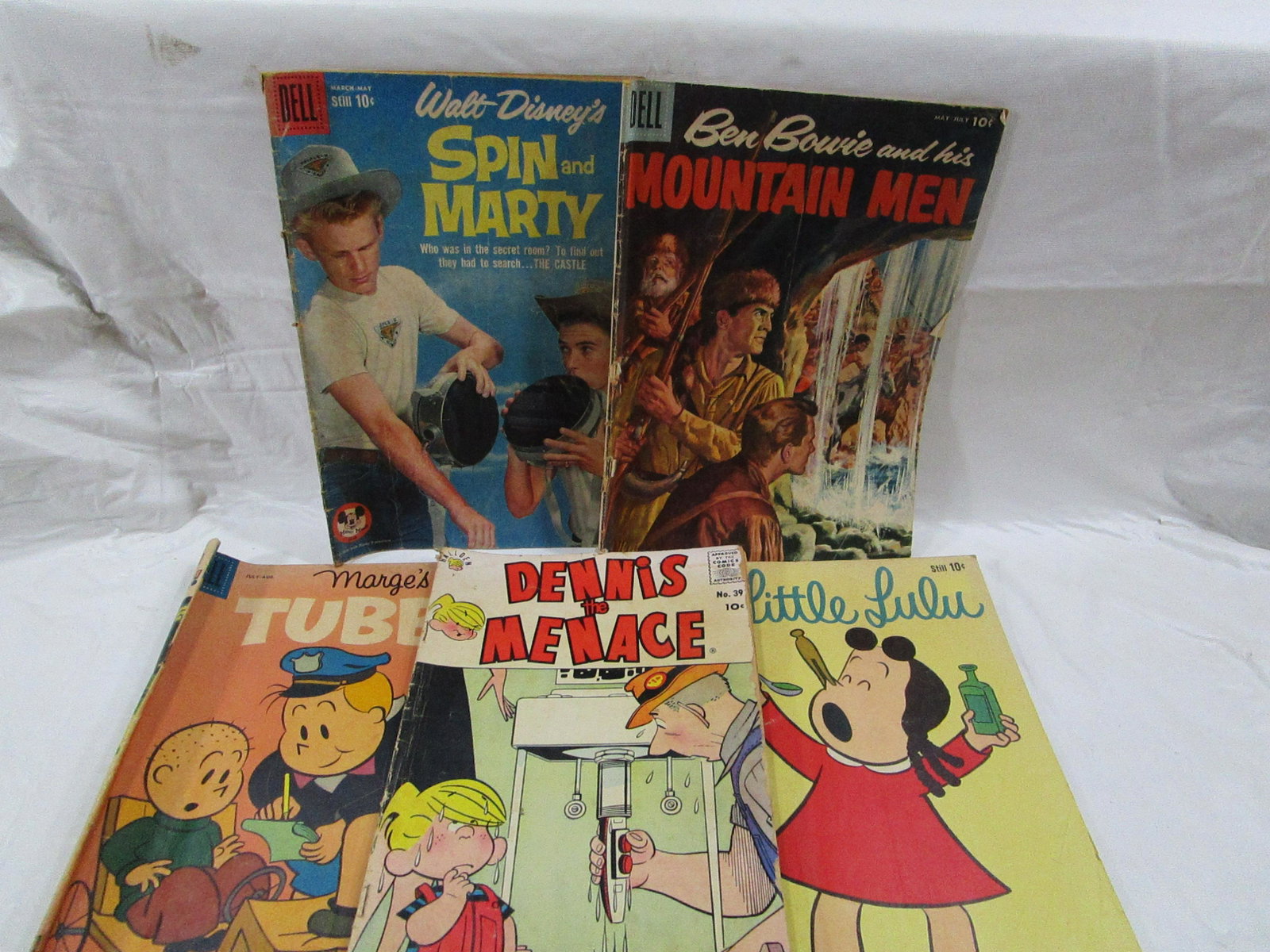 Lot of 5 Dell Comic Books 1959-1960's: This lot includes 5 comic books that show some wear and don't have protective sleeves. The lot includes Ben Bowie and His Mountain Men, Spin and Marty, Dennis the Menace and a few more.