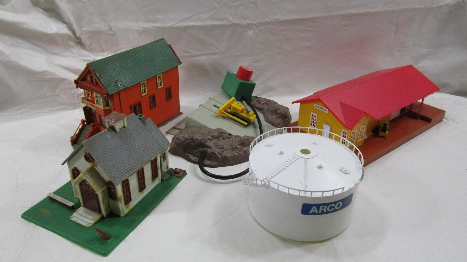 Lot Miscellaneous Toys Train Station?: One of the toys has wiring I believe that it was part of a toy train system. They are in decent condition but have been played but light soiling.