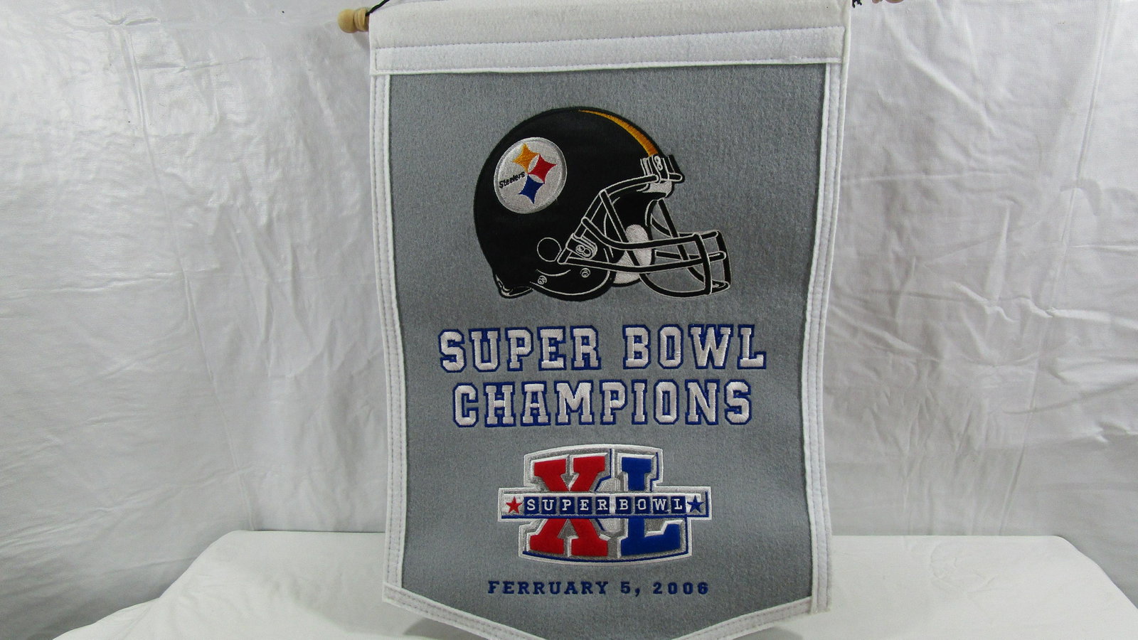 Super Bowl XL Champions Steelers Pennant W ERRORS: This pennant is in good condition. It has the date of the game misspelled. February is misspelled as being FERRURARY. It is about 18" tall and 12" wide