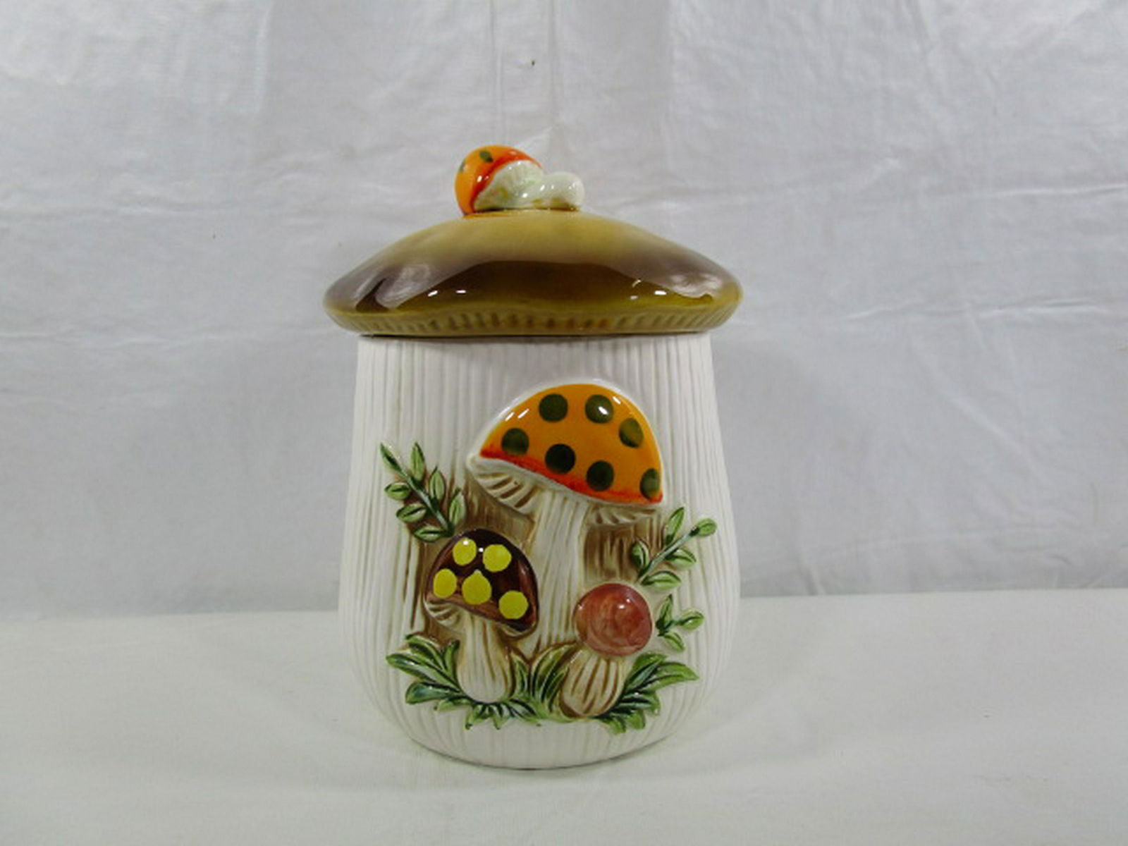 Medium Merry Mushroom Canister Sears & Roebuck: This canister was produced in 1983 and is in nice condition. It is about 8.5 and 5" diameter at the rim. We have the small and larger one listed also.