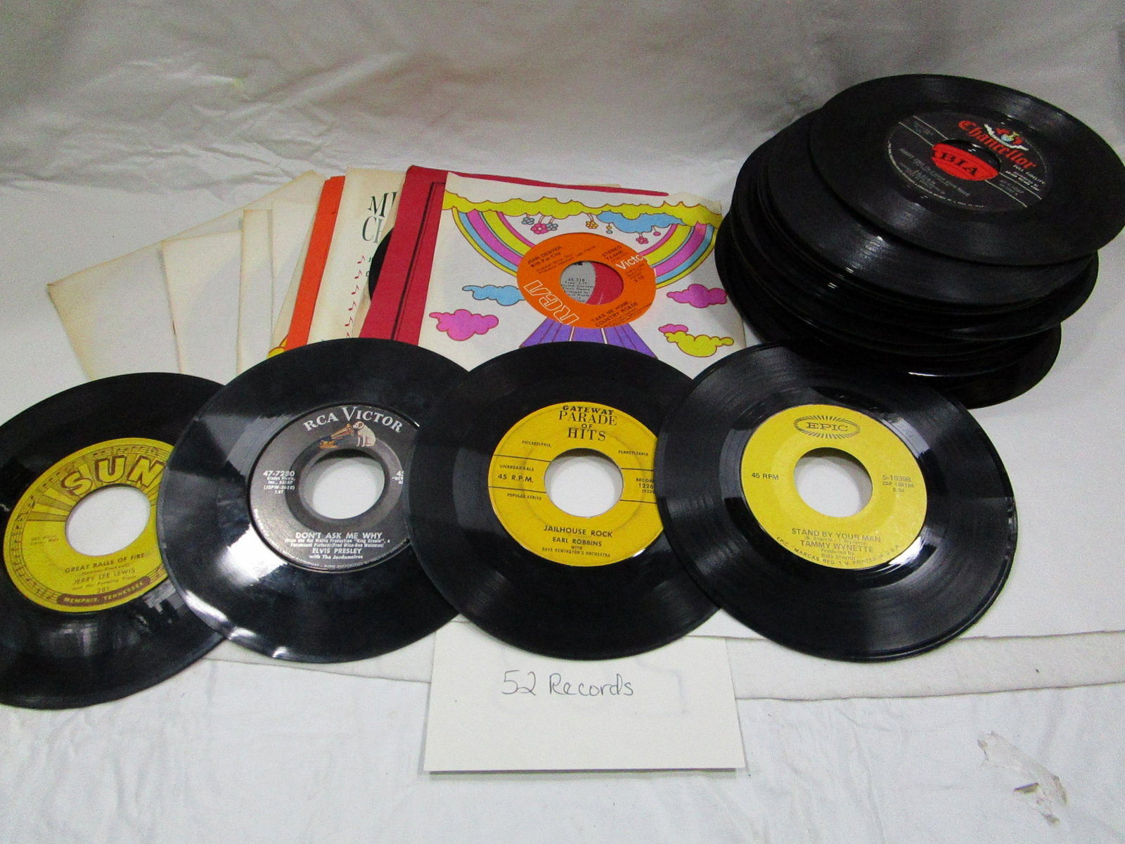 52 Records Lot 45 RPM: These records include John Denver, Elvis, Jerry Lewis and Tammy Wynette. They are in decent used condition. Some records come with original sleeves.