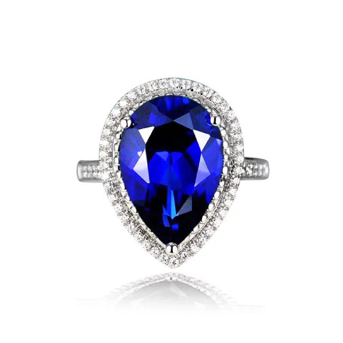 925 Silver 7.442ct Tanzanite 0.568ct Diamond Ring: 925 Silver 7.442ct Tanzanite 0.568ct Diamond Ring ****** Metal: 925 Silver / Total Item Weight: 4.9 grams / Main Stone: Tanzanite / Color: Blue / Carat Total Weight: 7.442 / Secondary Stone: Diamond /