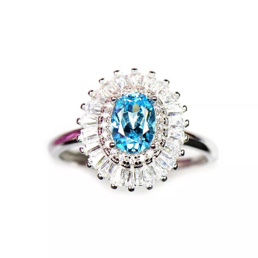 925 Silver 1.51ct Topaz 0.321ct Diamond Ring: 925 Silver 1.51ct Topaz 0.321ct Diamond Ring ****** Metal: 925 Silver / Total Item Weight: 2.7 grams / Main Stone: Topaz / Color: Blue / Carat Total Weight: 1.51 / Secondary Stone: Diamond / Carat Tot