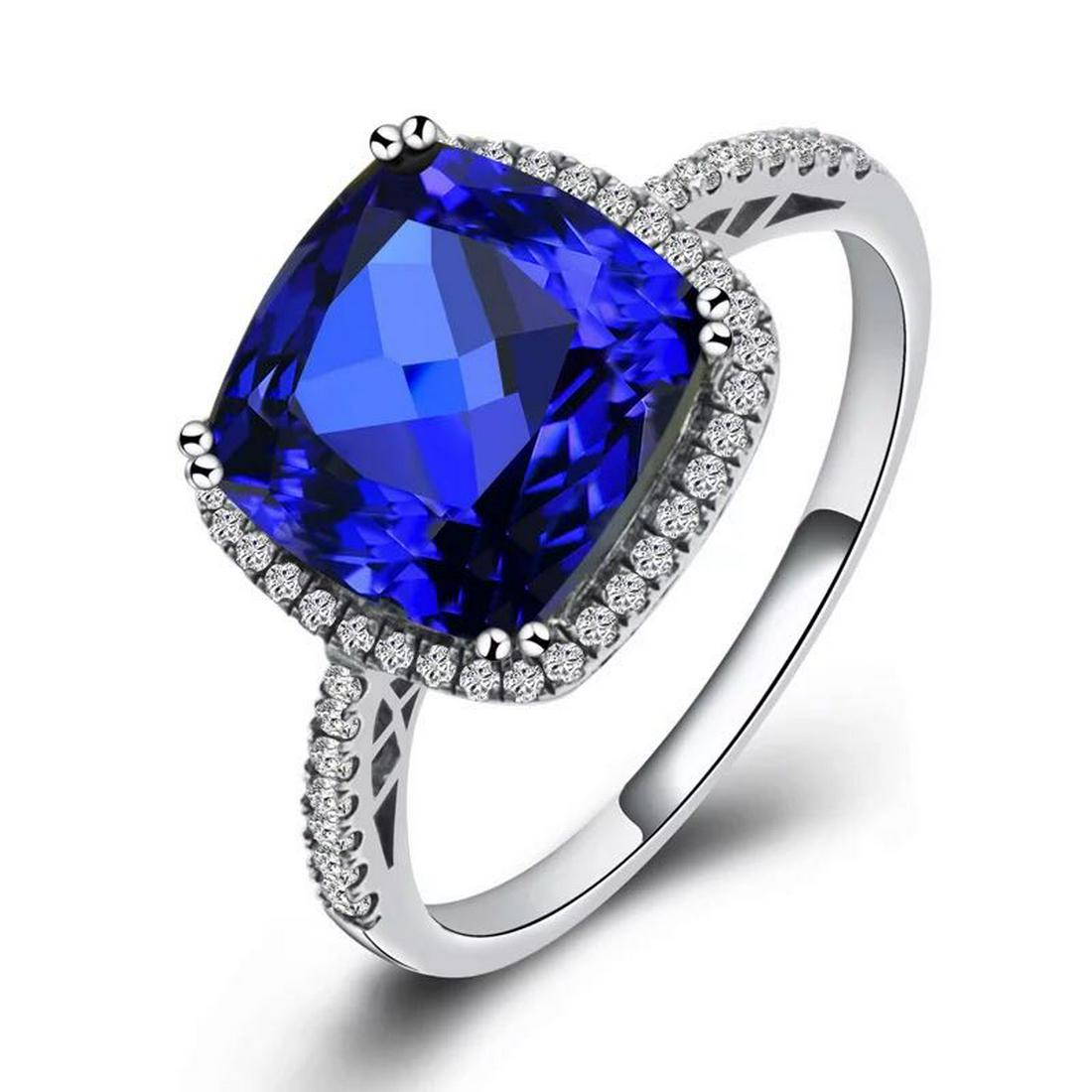 925 Silver 6.5ct Tanzanite 0.562ct Diamond Ring: 925 Silver 6.5ct Tanzanite 0.562ct Diamond Ring ****** Metal: 925 Silver / Total Item Weight: 3.3 grams / Main Stone: Tanzanite / Color: Blue / Carat Total Weight: 6.5 / Secondary Stone: Diamond / Car