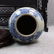 A BLUE WHITE GENERAL TANK WITH CHARACTER PAINTING - 4