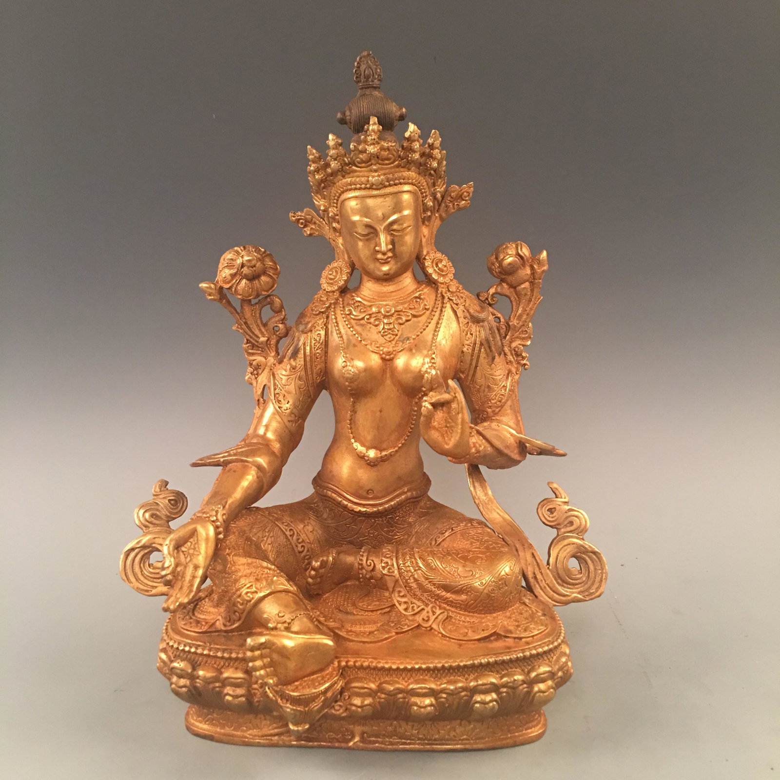 Chinese Gilded-bronze Figure of Green Tara: Chinese Gilded-bronze Figure of Green Tara 12-1/4'' H; 9-7/8'' W; 5.6 lb Shipping: We are able to pack and ship this item to an address in the United States via UPS Ground or USPS Priority Mail for $5