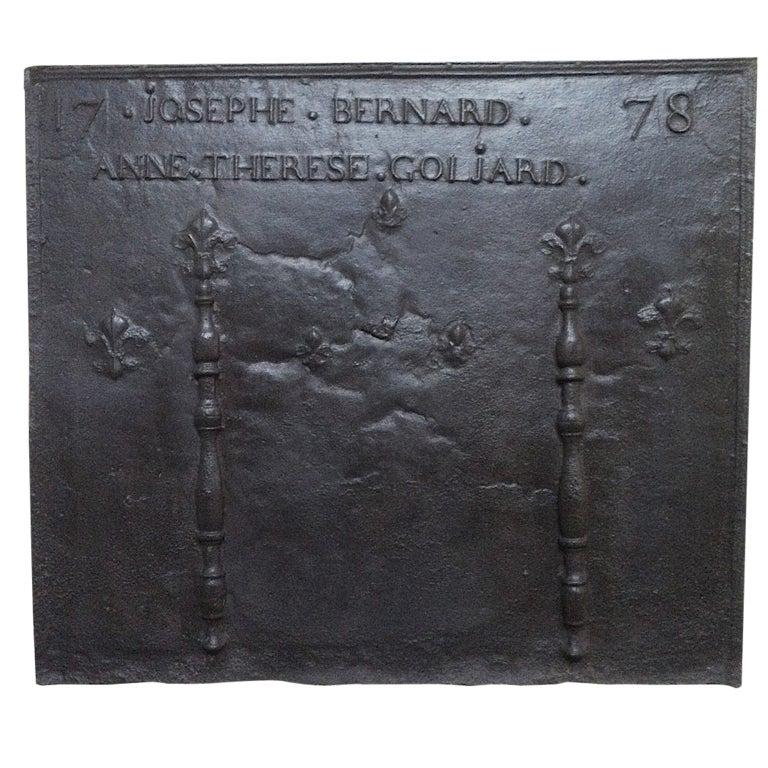 Fireback Fleurs-de-Lys dated 1778 "Joseph" France: A large French antique fireback in cast-iron, Fleurs-de-Lys design with family names ("Joseph Bernard and Anne Therese Goljard"), dated 1778 from France. Authentic and original. Available right now fr