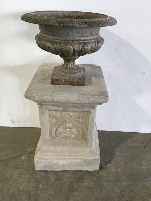 French Medici Urn in iron and pedestal in stone, France: French antique Medici urn in iron and its pedestal in stone early 1900s. Provenance: Paris, France.