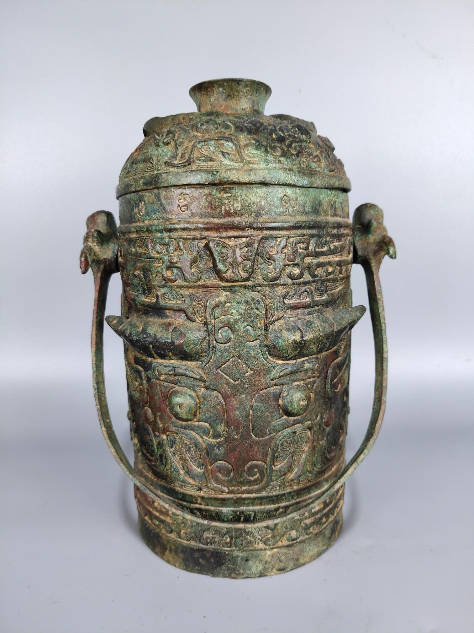 Shang and Zhou bronze pot with animal face and beam (1 of 9)