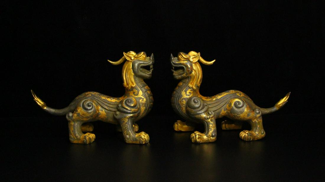 A pair of partial gilt beasts from the Han Dynasty (1 of 9)