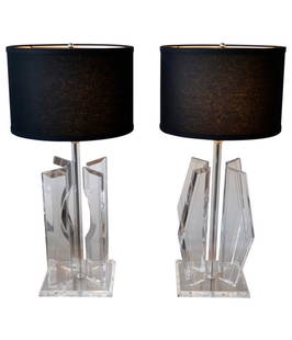 Pair of Mid Century Modern Sculptural Lucite and Chrome Table Lamps, 1970's: Large Mid-Century Modern sculptural lucite and chrome table lamps. Each with unique shape, 1 inch thick lucite panels.Height: 23 in (58.42 cm)Width: 9 in (22.86 cm)Depth: 9 in (22.86 cm)SHADES NOT INC