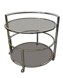 Mid Century Round Two-Tier Expandable Side Table or Coffee Table, Chrome and Glass: Mid-Century Modern two-tier round side or coffee table that expands if desired. Chrome frame with smoked glass, on castors. Very similar to the designs of Milo Baughman.Height: 21 in (53.34 cm)Diamete