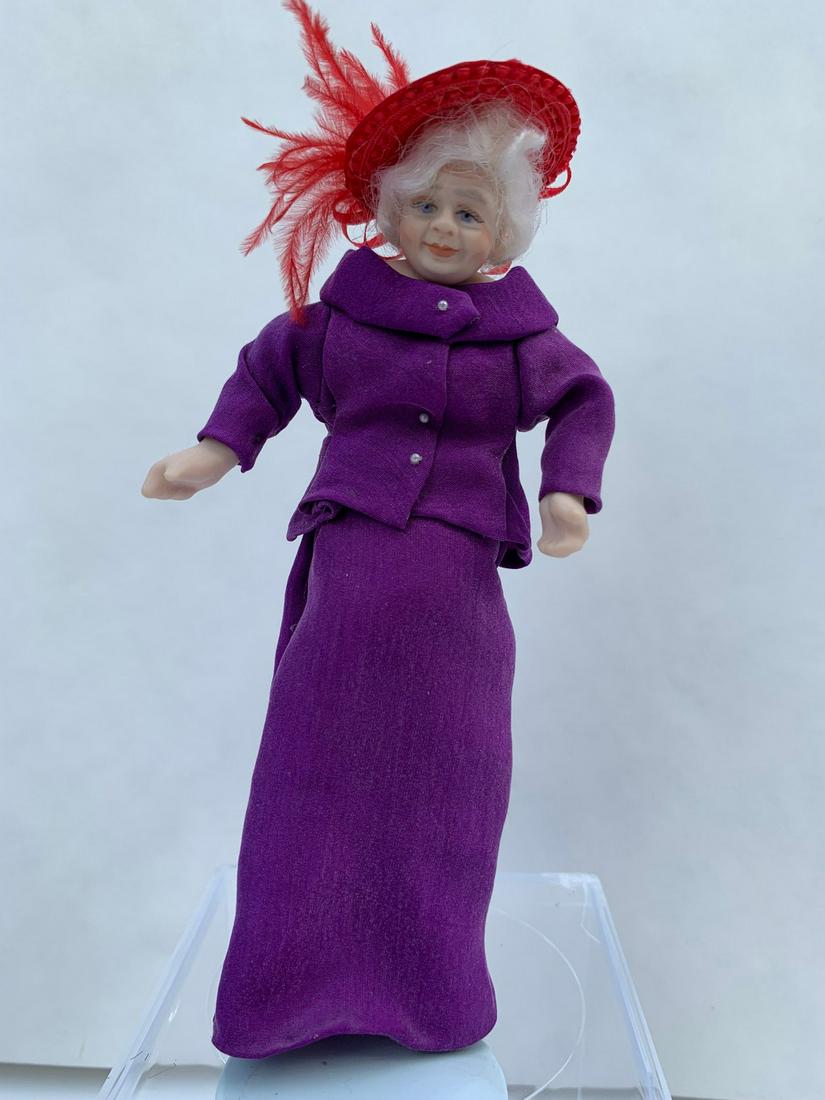 Red Hat Society Doll - Handmade Porcelain: This is a handmade porcelain doll dressed in the Red Hat Society fashion. She's nicely painted and has white hair and a purple outfit with of course her red hat.