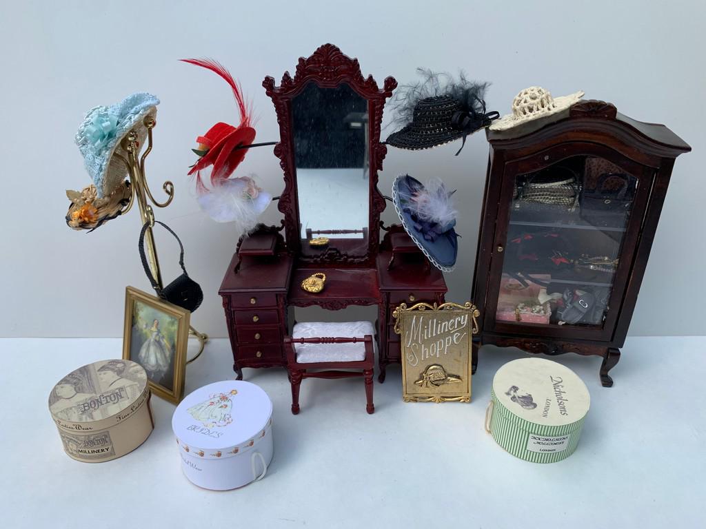 Milliner Shop Lot w/ Bespaq Vanity & Cabinet Full: This is a large variety of a Milliner shop and ladies items. The sign is from Jeanetta Kendall, made of metal and aged gold colored. The vanity and cabinet are made by Bespaq. The hat boxes are from E