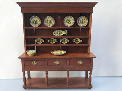 Quimper ware Deborah McKnight & Escutcheon Cabinet: IGMA artisan Deborah McKnight handmade and hand painted Quimper ware dinner set. The pieces are removable and only on with fun tac. The hutch is handmade in England by Escutcheon Miniatures.