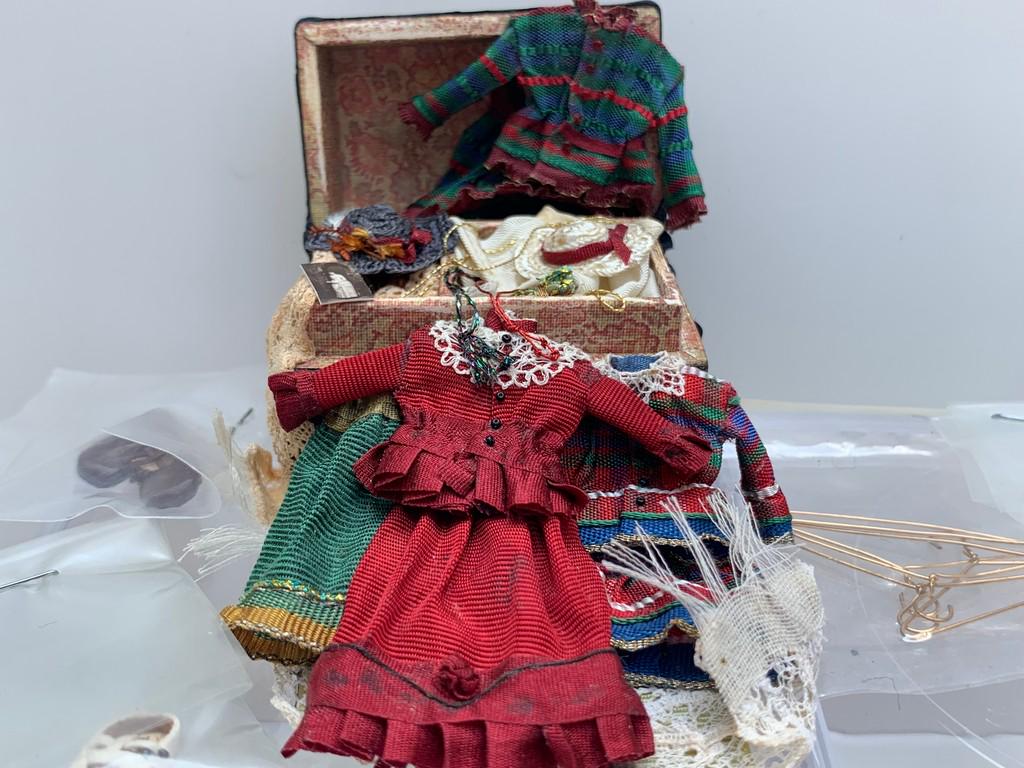 Child's Trunk Set with Dolls Cobbler Vtg. Shoes: This is a handmade child's trunk with dresses, hats and clothing handmade by Barbara Logan. There are new, older stock Dolls Cobbler shoes still in the packaging. Mary Jane shoes.