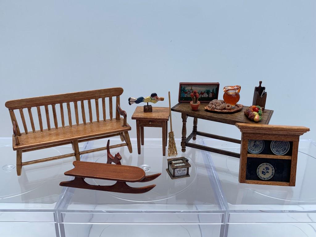 1/2" Scale Primitive/Shaker 15+ Pc Furniture Lot: This is a lot a Deacons Bench by D2E, Sled by D2E, Cathy Hollis wooden figurine, pipe box, foot warmer, table, side table, Wooden wallhanging or pin with Jane Graber stoneware pottery plates, cider an