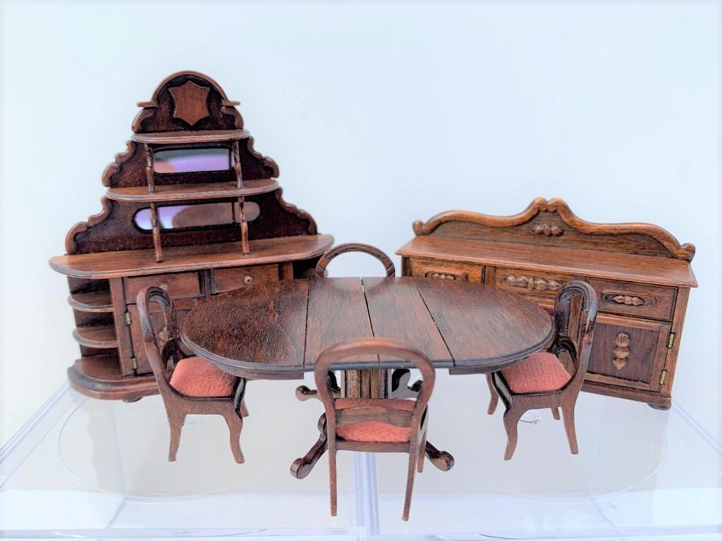 1/2" - 7 Pc Dining Room Set, Artisan Signed: This is a wooden hand crafted table and four chairs with cushions. Wooden hutch and sideboard with drawers. Cushions are dusty rose color. Crafted by the artist and signed Cajey (not sure the spelling