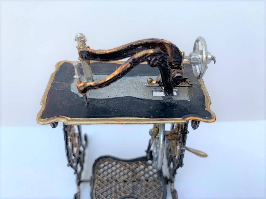 Black Metal Antique Sewing Machine 19th c Germany: Â This is an antique treadle sewing machine in painted asphaltum replica of a period 19th c sewing machine. Made in Germany.