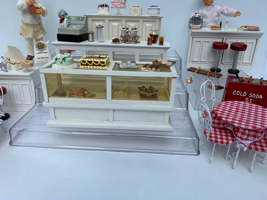 Large Bakery Lot w/ Cakes, Foods & Cases: This is a large variety of Bakery items as well as some diner things. Counters and cabinets with bar stools, two soda fountain metal tables and chairs, bakery cakes, jukebox, straw holder, napkin hold