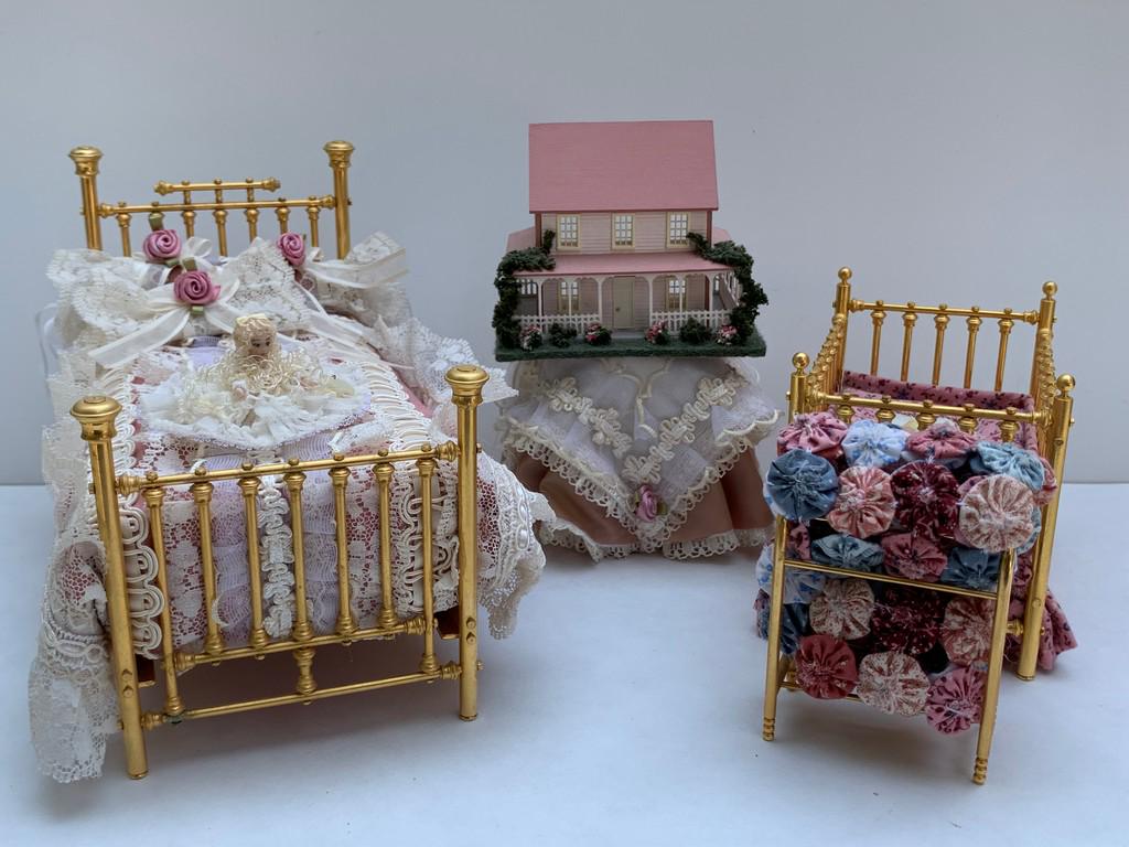Clare Bell Brass Bed & Matching Crib w/ Dollhouse: This lot consists of a Clare Bell Brass bed with bedding. Next to that is a Clare Bell brass crib. Both brass pieces are solid and are no longer available by Clare Bell brass. In addition, there is a