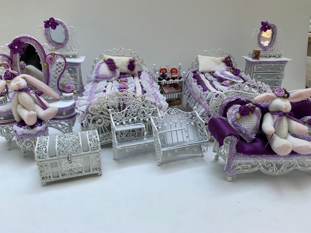 11 Pc Wicker Bedroom For Twin Girls w/ Purple: This is an 11 piece wire wicker bedroom set. Great for twins. The beds are dressed with white and purple dÃ©cor. There are two matching dressers, two shelves, two bunny rabbits, one couch that is de