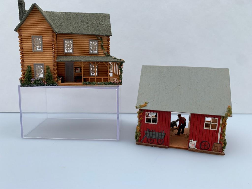 144 Scale Pat Russo Decorated Barn & Log Cabin: Pat Russo made and signed both pieces. The log cabin is 144 scale as well as the barn. The barn is decorated with a farmer, animals and hay. The log cabin has a clothesline with clothes on the porch.