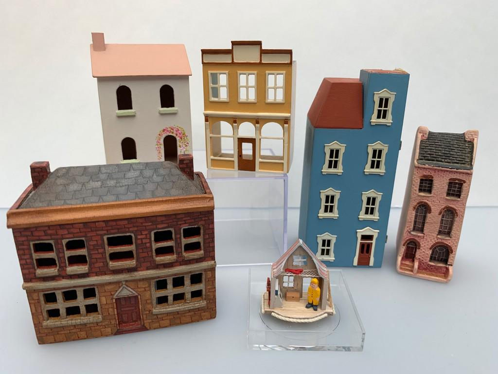 144 Scale Lot of 6 Dollhouses, Pam Bacon, Street: This is an assorted lot of 144 scale houses including a Boat House. There's a blue Victorian townhouse signed Robert Evans, a painted brick house by Pam Bacon, a pink and green house by Banard, a yell