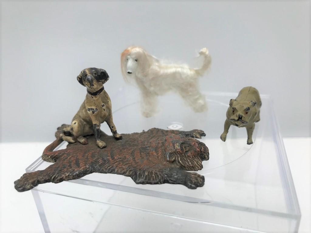 Vintage Lot of Metal Dogs - One Is on Tiger Rug: This lot is for a cast iron dog on a tiger rug. The pieces are attached and vintage. There's a metal dog with white hair as well as a pewter dog marked England.