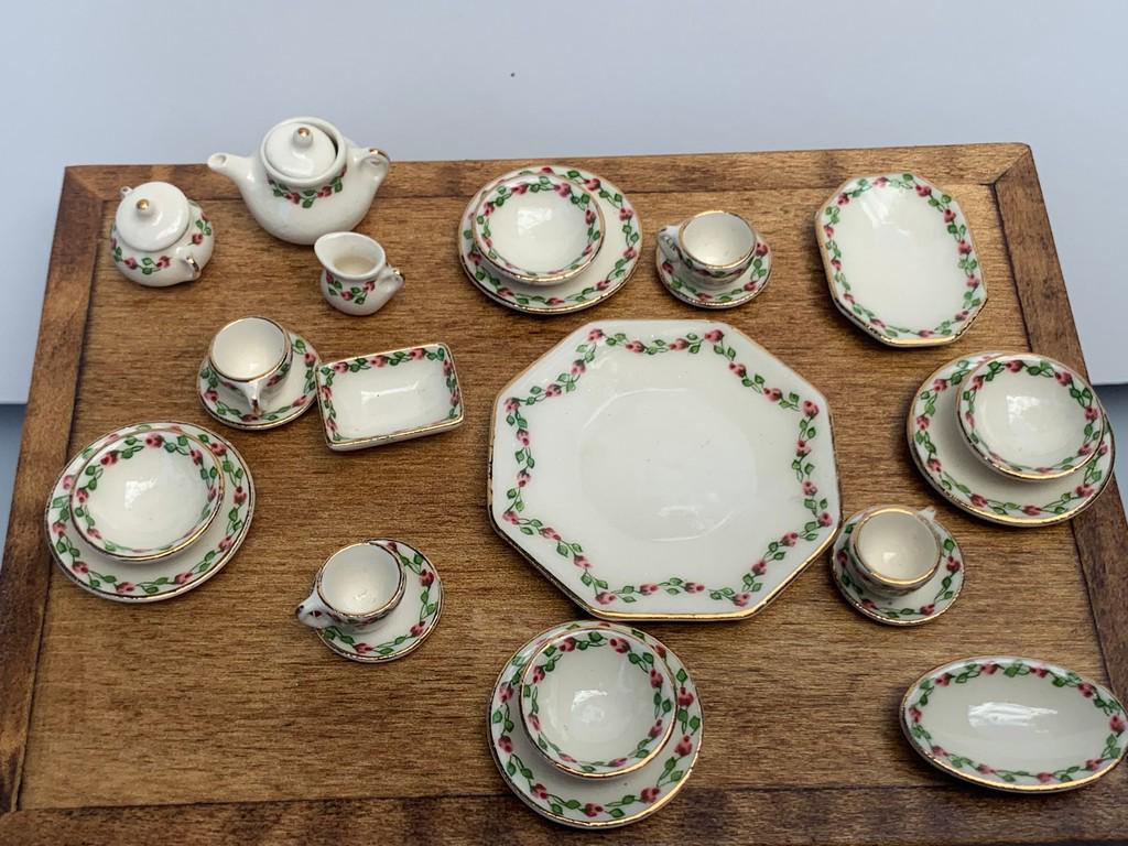 Rebecca Reilly Dinner Service - Rosebud Design: This is a beautiful dinner service by Rebecca Reilly. There's four plates, four bowls, four cups, four saucers, a platter, large platter, butter dish, teapot, creamer and sugar bowl. A terrific set. M