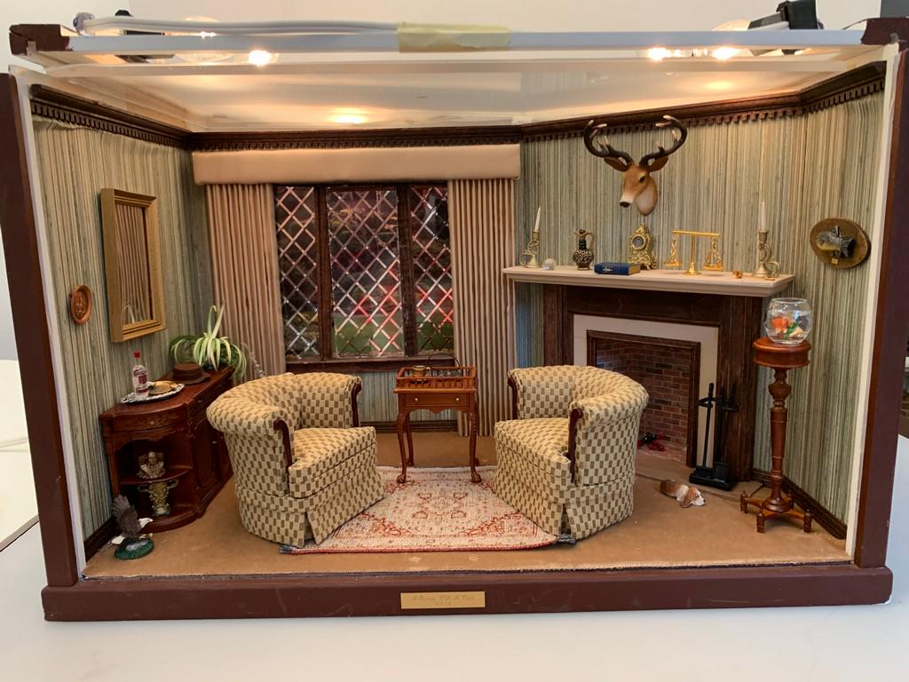 Tudor Style Decorated Roombox w/Bespaq Chairs: This is a Tudor Style decorated roombox. Inside the roombox are a pair of Bespaq chairs and table. There are accessories decorating the roombox with more furniture and a fireplace. The roof is removab