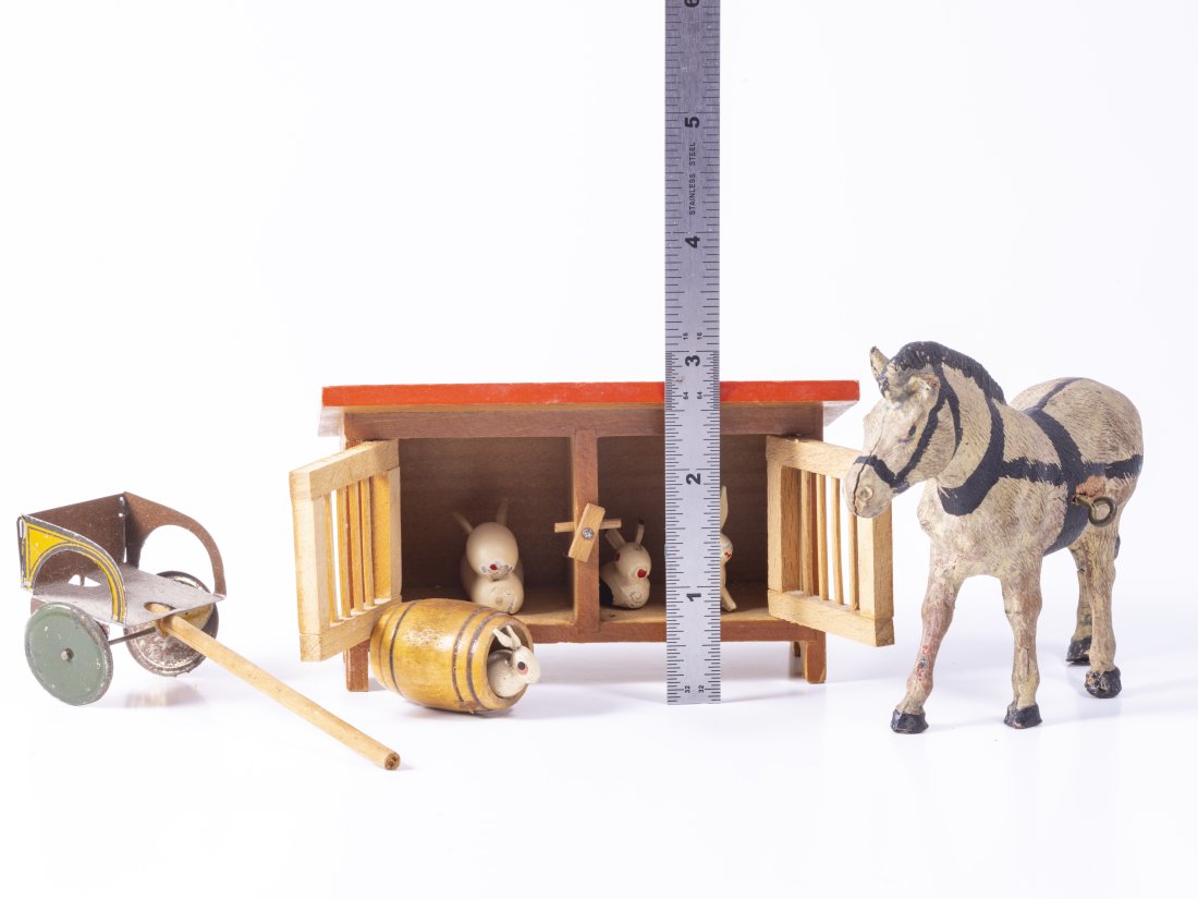 Vintage Farm Animals of Bunny / Rabbit Hutch and Horse with Dollssulky: Marked Made in Germany Rabbit Hutch with wooden rabbits, as well as a rabbit in a barrel. The horse is composite and the back leg is cracked. There's a metal and wooden Doll Sulky. Rabbit hutch: 4 1/2