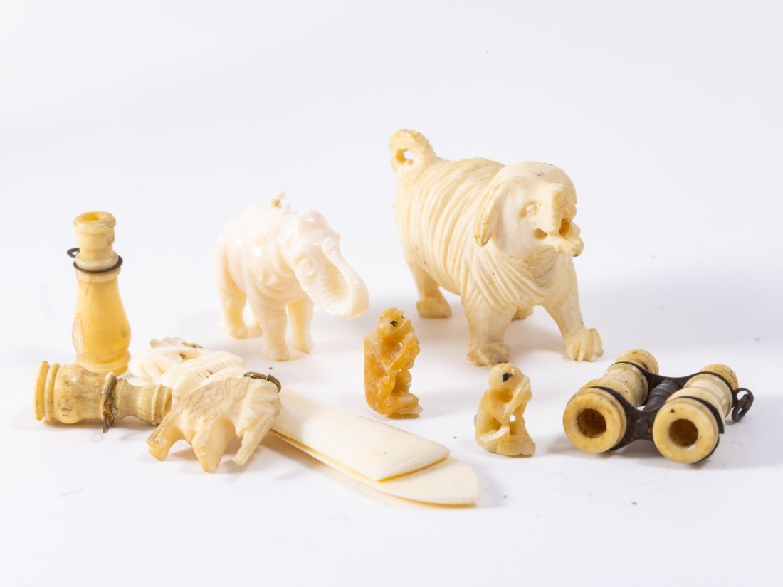 Vintage/Antique Bone Carved Animals & Binoculars: A bookmark with an Elephant, standing Elephant, Elephant charm, one pair of binoculars, one broken pair of binoculars (missing piece of metal), large dog and tiny monkeys. Large dog: 1 1/2" x 3/4" x 1