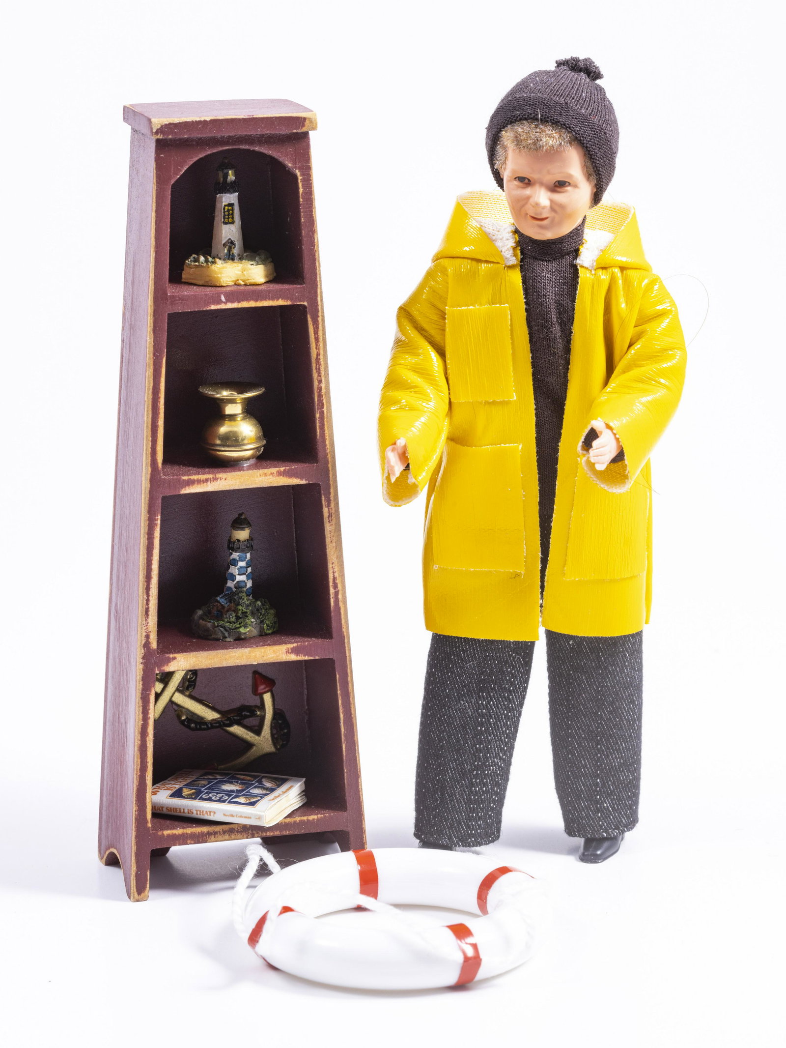 Fisherman with Life Saver & Decorated Cabinet: Decorated cabinet filled with nautical themed miniatures. The fisherman is made of resin and can be used as a doll or a statue/figurine.