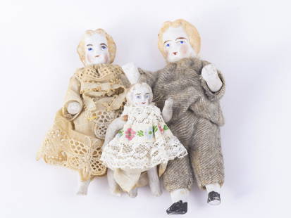 Antique German children, a boy, girl and a baby. Bisque dolls, vintage clothing and lace. Molded: Antique German children, a boy, girl and a baby. Bisque dolls, vintage clothing and lace. Molded hair. Baby measures 2 1/4" tall, note some imperfections.