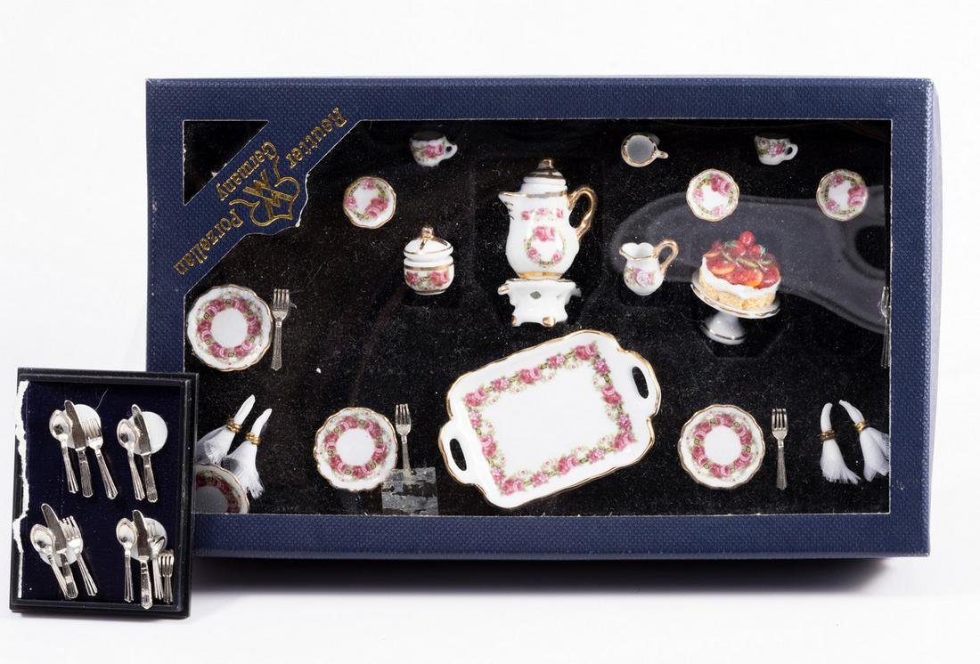 Reutter Porcelain Discontinued Dinner Service with Boxed Cutlery: This is a boxed Reutter Porcelain boxed dinner service with a coffee pot, creamer, sugar, four side plates, four cups and four saucers. There's a delicious cake on top of the cake stand and four forks