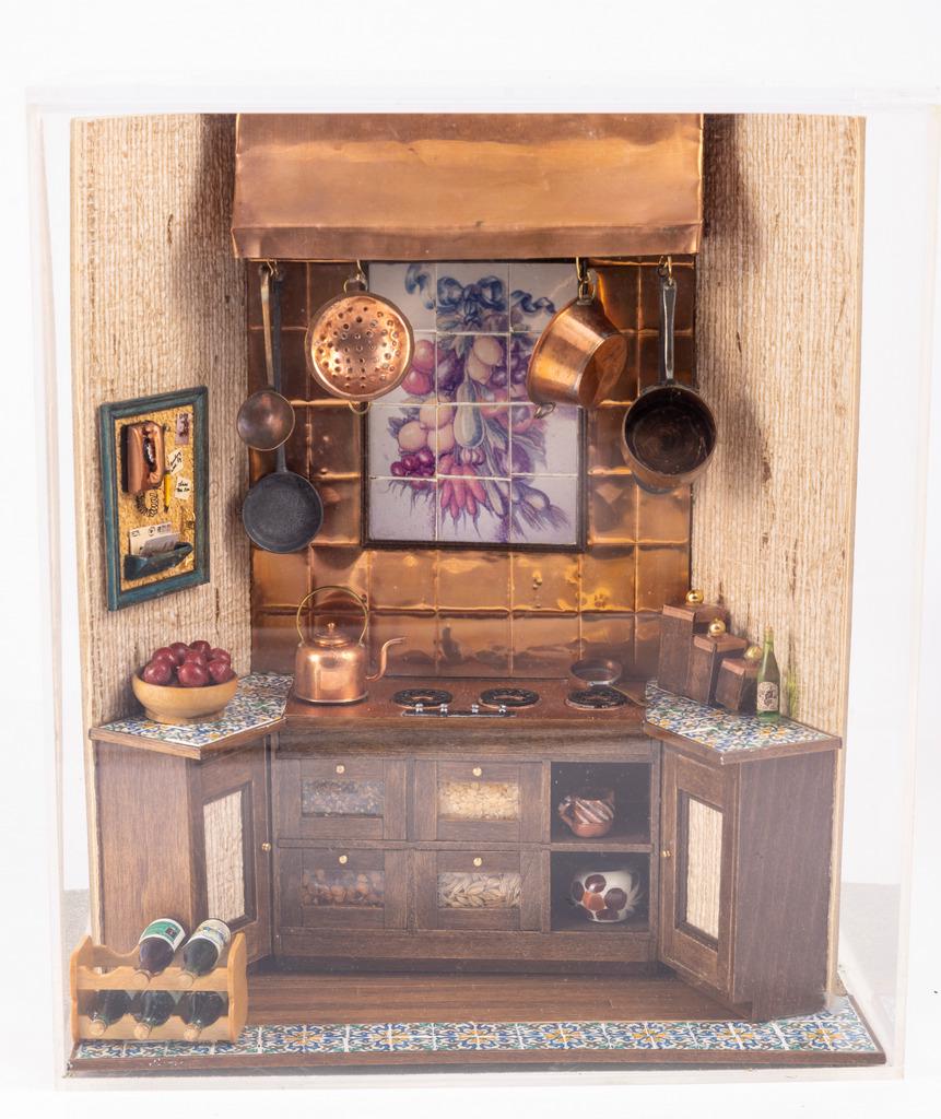 European Kitchen Stove Decorated with Handmade Copper: This is a lovely European kitchen diorama. The stove is decorated with handmade copper including a split lip copper teapot. The stove has four bins underneath with different spices. Decorative tiles, 