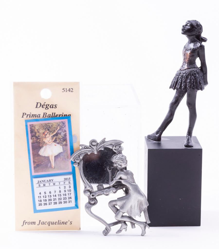 Ballerina Statue & Mirror: This is a beautiful ballerina statue/figurine. She's standing with her head held high. There's also a terrific mirror of a ballerina looking into the mirror. There's a calendar as well, made of paper.