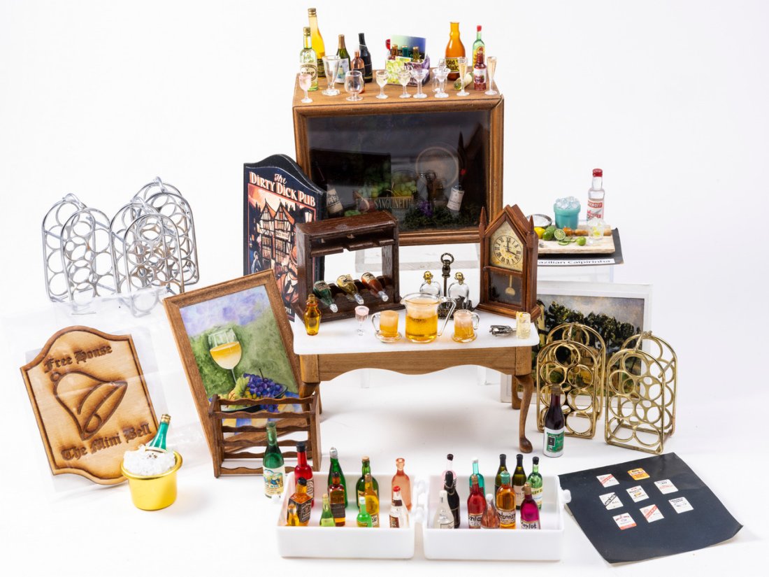 Wine & Liquor Cabinet & Accessories: A big variety of wine bottles, wine cabinet, table, wine racks, wine painting, wine display in box, labels for wine bottles, pitcher of beer and beer mugs, decanter set and more in this lot.