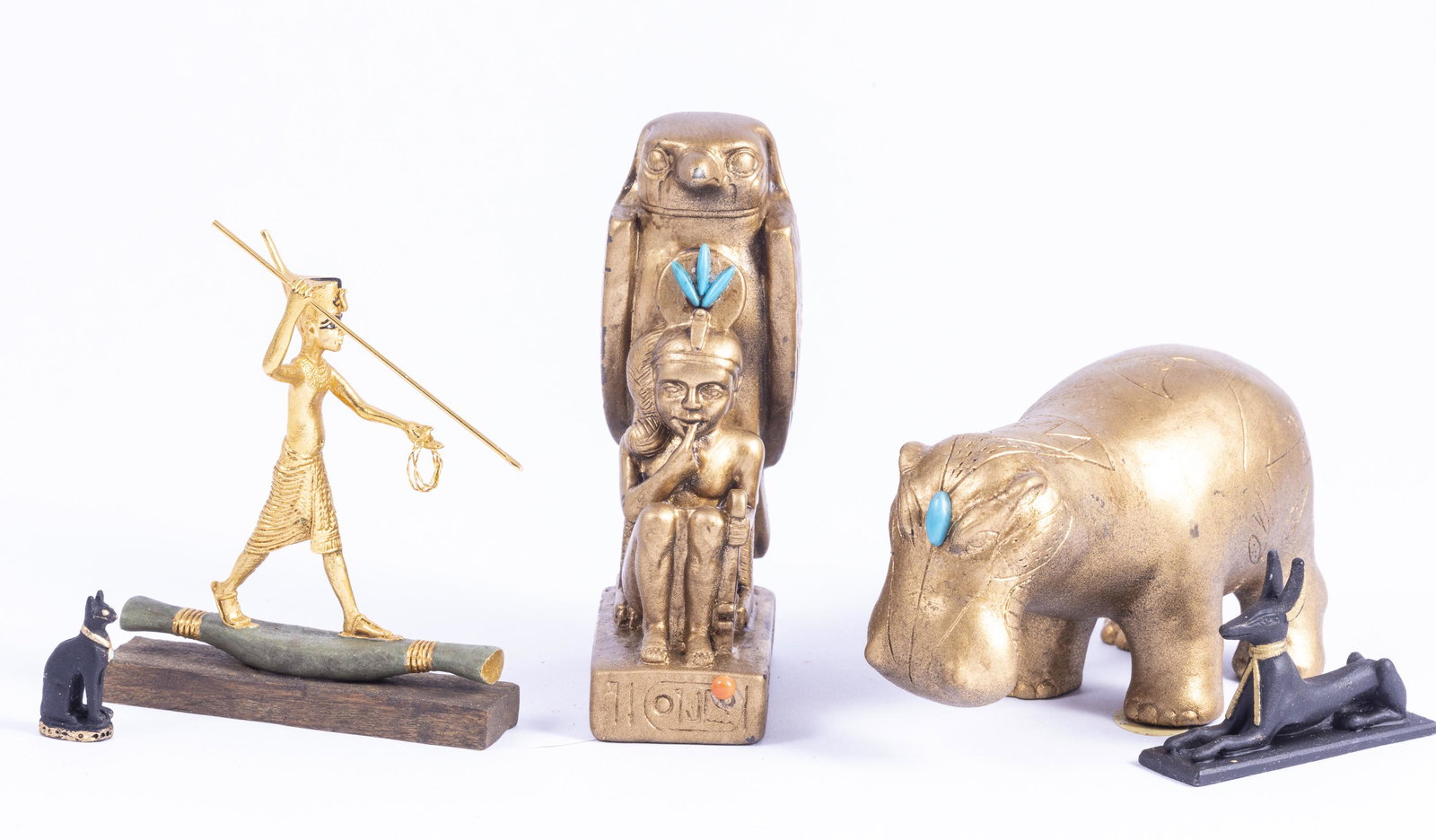Artisan Egyptian Variety with Neil Carter Figurine: This variety is well made, good quality including one piece by Neil Carter of England. A great assortment of Egyptian pieces. The hippo and Horus are signed R.H. Black sphinx is painted metal and blac