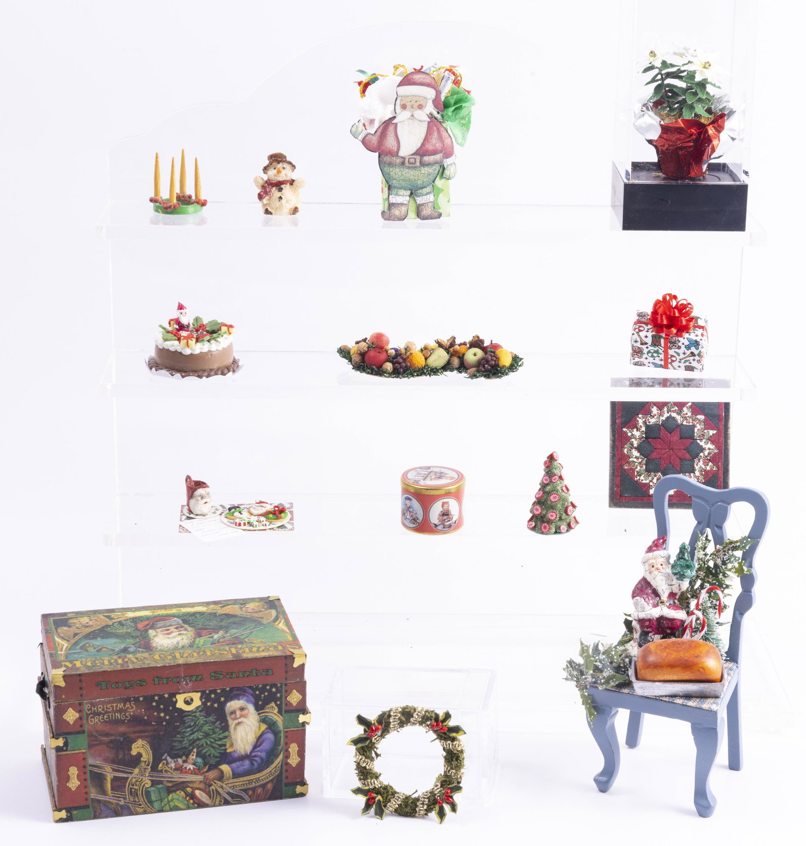 Handcrafted & Artisan Christmas Pieces: So many lovely pieces, we begin with a Christmas trunk that measures approx. 3" x 1 3/4" x 1 7/8" (high),decorated blue chair, a beautiful poinsettia plant under a case, wreath, cake, cornucopia, lett