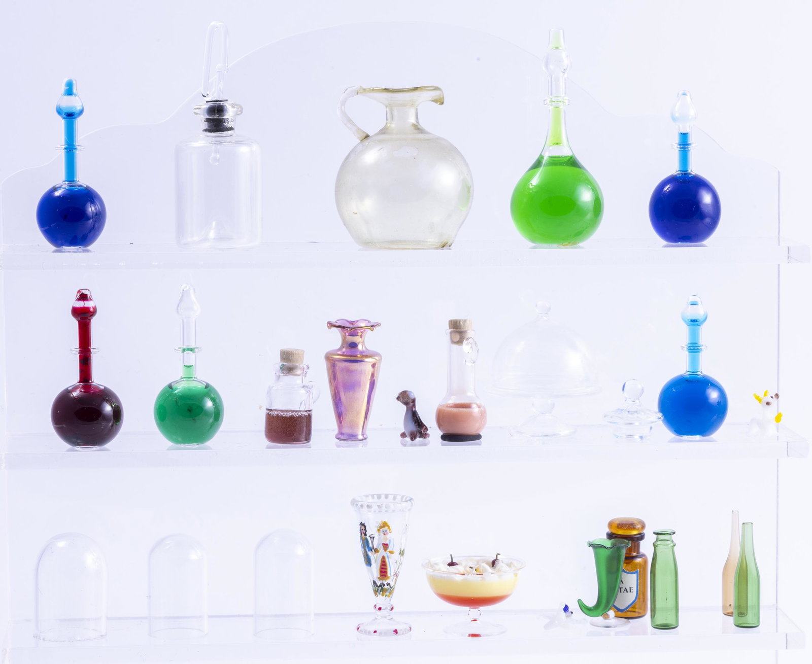 Apothecary Glass Bottles & Blown Glassware From England: Francis Whittemore green cornucopia vase, apothocary bottles with liquid inside, blown glass ware and domes from England, trifle, bottles and vases.