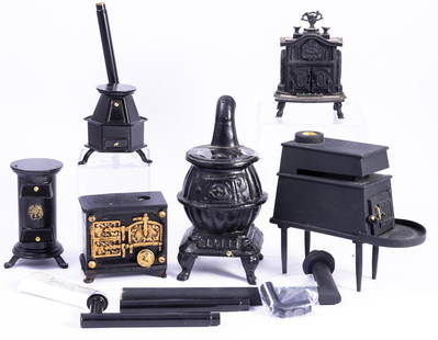 Baby It's Cold Outside - Not Anymore! Stoves & Stoves: Metal stove, Onward vintage cast iron stove, small parlor stove, Roy Bubbenmoyer tall stack stove artisan made, and a stove to heat irons from England.