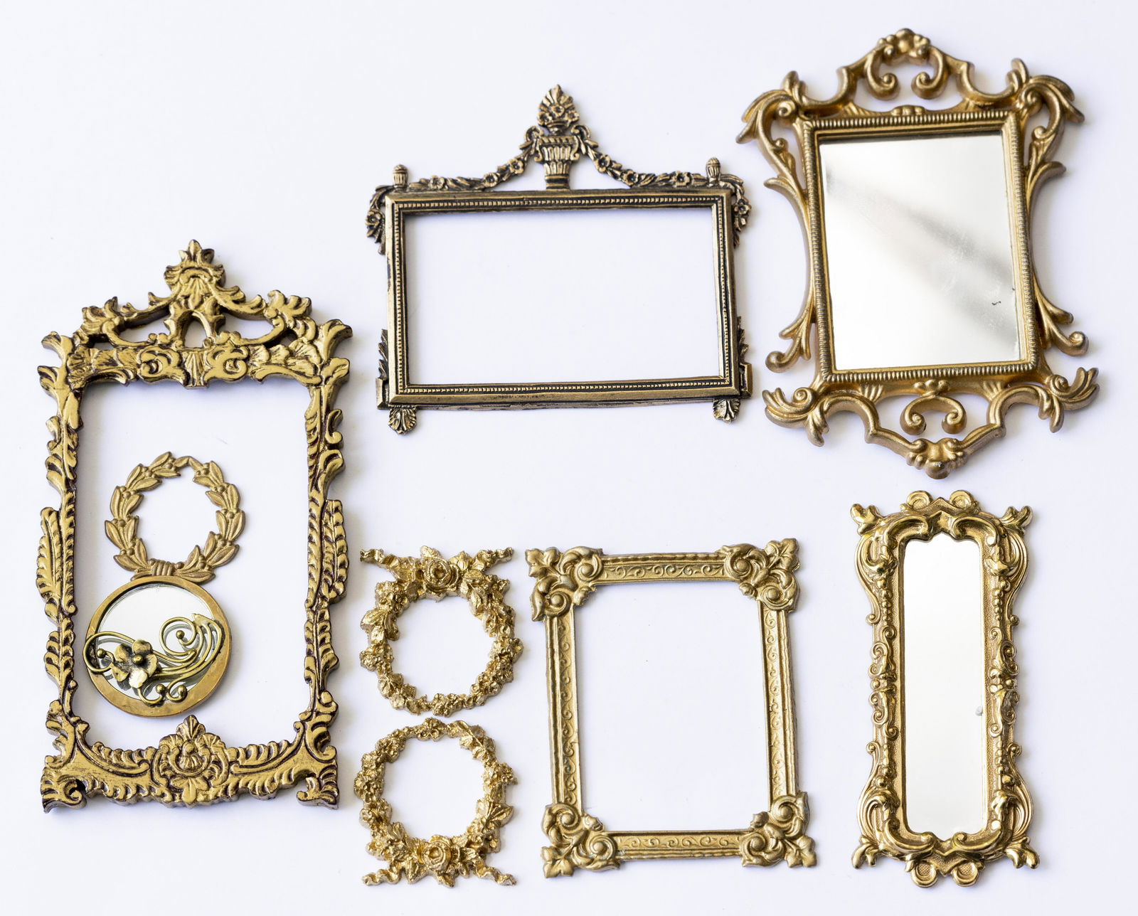 Aged Gold Colored Metal Mirrors & Picture Frames, Large Assortment: A large and lovely assortment of aged gold and brass colored metal frames. All nice detail, mirrors and frames, great variety.