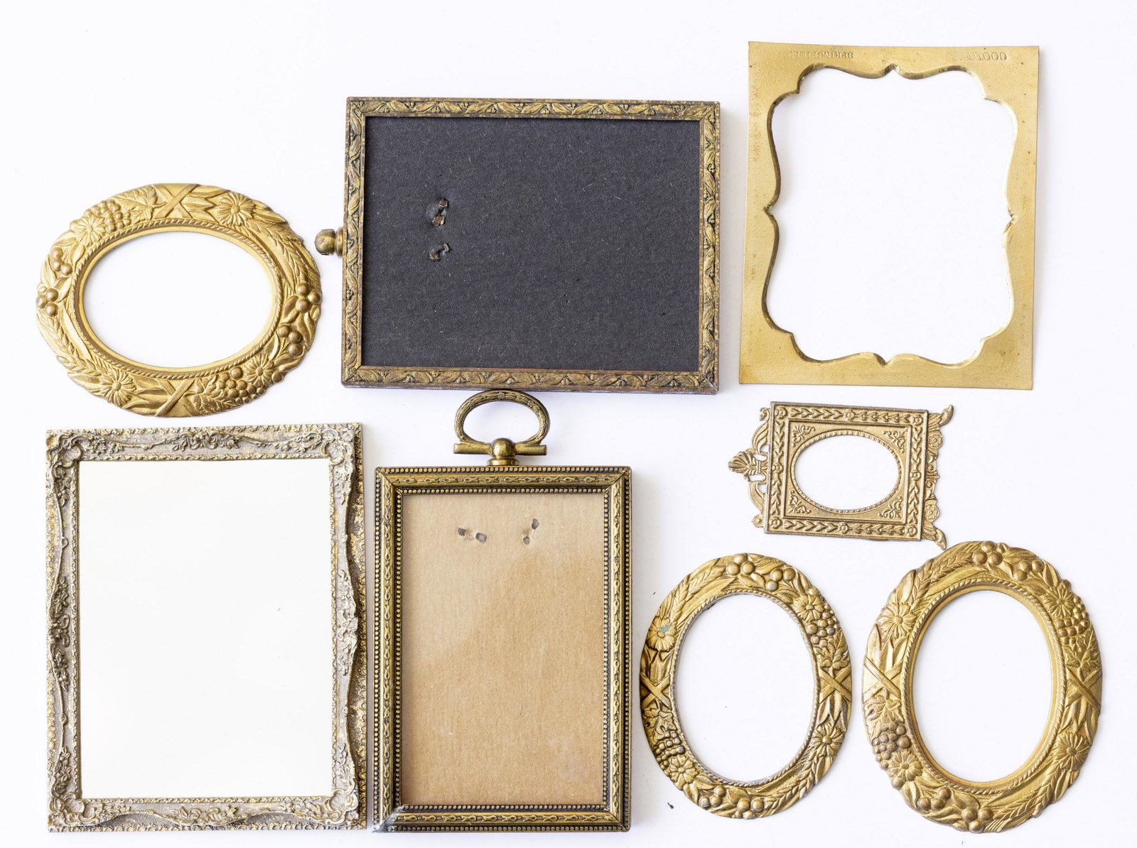 Round & Rectangular Metal Pictre Frames, Some Heavy: A great vareity of aged metal looking picture frames. Some are heavy and have a bit of weight to them, the large one with with loop to hang. The round frames also have some weight to them and nice det
